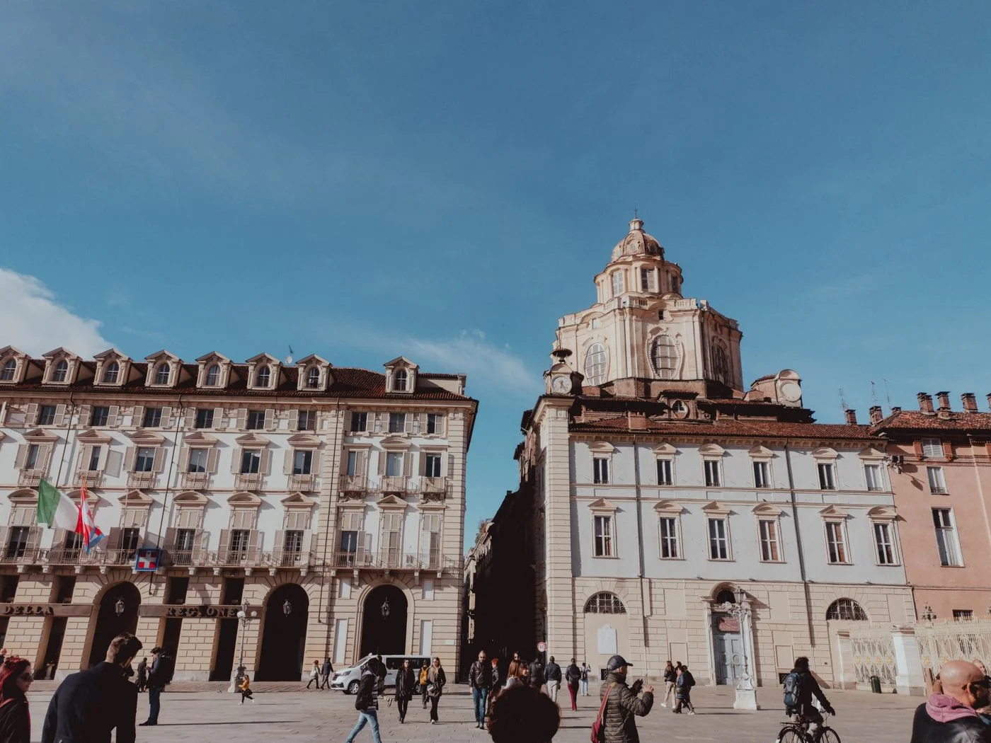 Historic buildings around a central square in Turin.
