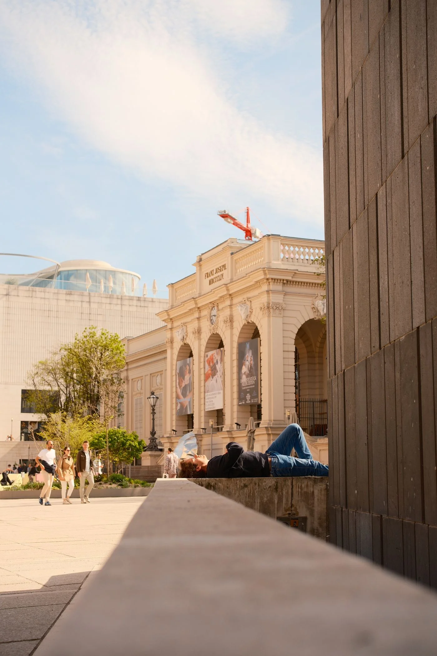 People relaxing among the buildings of MuseumsQuartier in Vienna.